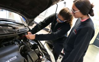 Norwich Tech Automotive Technology students working on car