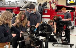 Diesel and Heavy-Duty Equipment Repair students work on equipment in the shop