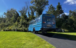 Image of blue CTECS Student Workforce bus from A.I. Prince Technical High School